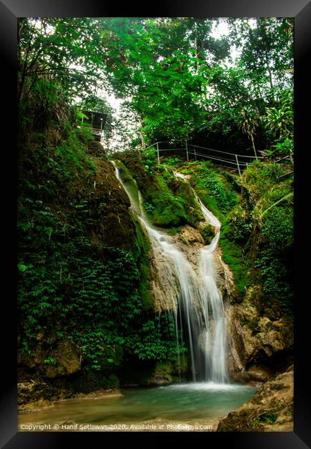 Rain forest waterfall Mudal Framed Print by Hanif Setiawan