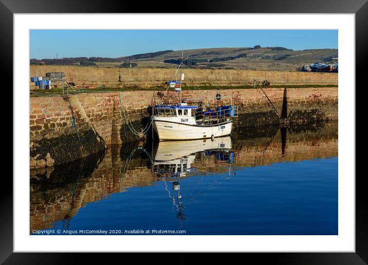 Fishing boat tied up in Cromarty harbour Framed Mounted Print by Angus McComiskey