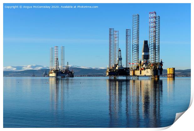 Decommissioned oil rigs in Cromarty Firth Print by Angus McComiskey