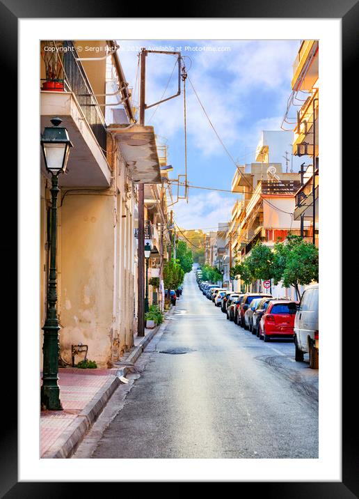 Deserted old narrow street of Loutraki in Greece in the early morning in the rays of the rising summer sun. Framed Mounted Print by Sergii Petruk