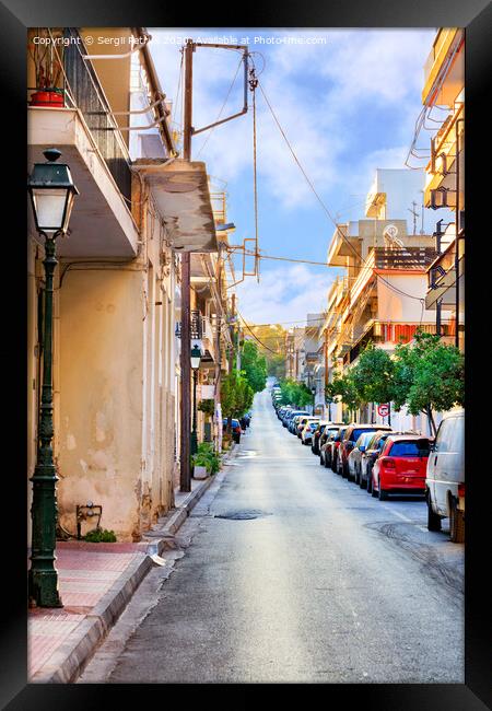 Deserted old narrow street of Loutraki in Greece in the early morning in the rays of the rising summer sun. Framed Print by Sergii Petruk