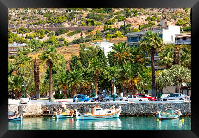 Scenic views of the bays of Loutraki, Greece, where old fishing schooners, boats and boats moor in the clear waters of the Ionian Sea. Framed Print by Sergii Petruk