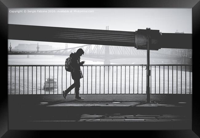 Walking on the bridge Framed Print by Sergio Falzone