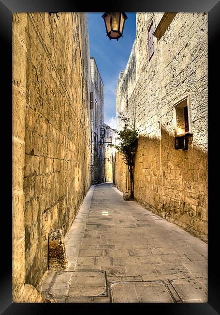Narrow street in Malta  Framed Print by David Stanforth