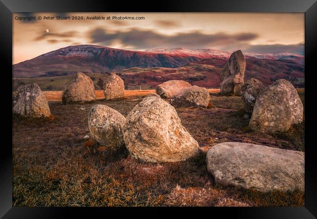 Castlerigg is perhaps the most atmospheric and dramatically sited of all British stone circles, with panoramic views and the mountains of Helvellyn and High Seat  Framed Print by Peter Stuart