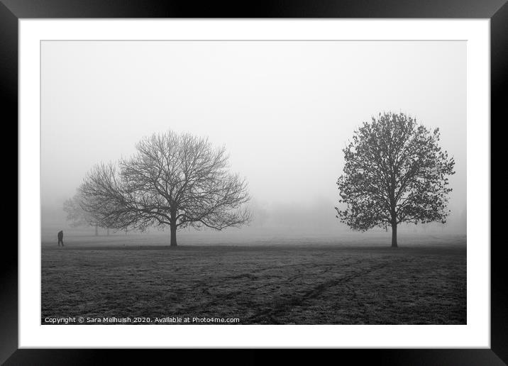 Two trees and a man in the fog Framed Mounted Print by Sara Melhuish