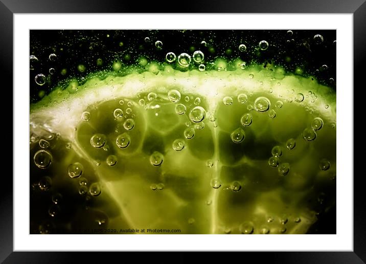 Lime slice in fizzy water Framed Mounted Print by Simon Bratt LRPS