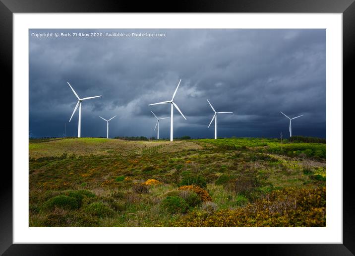 Windmills against dramatic sky. Framed Mounted Print by Boris Zhitkov