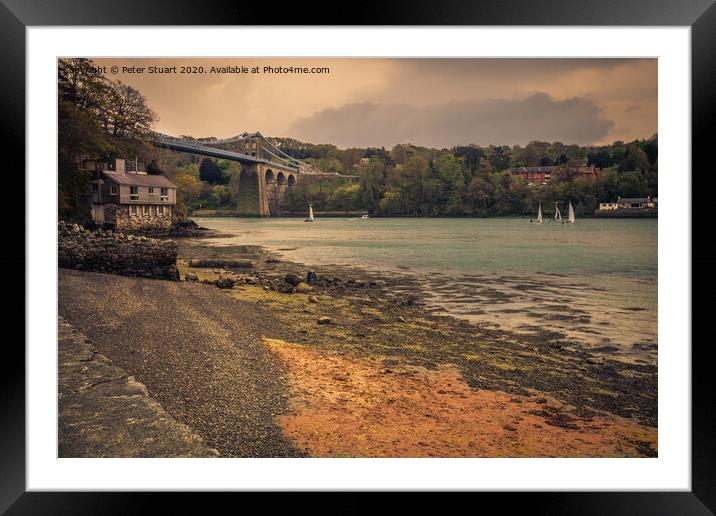 Boats sailing towards the Menai Bridge near Anglesey in North Wales Framed Mounted Print by Peter Stuart