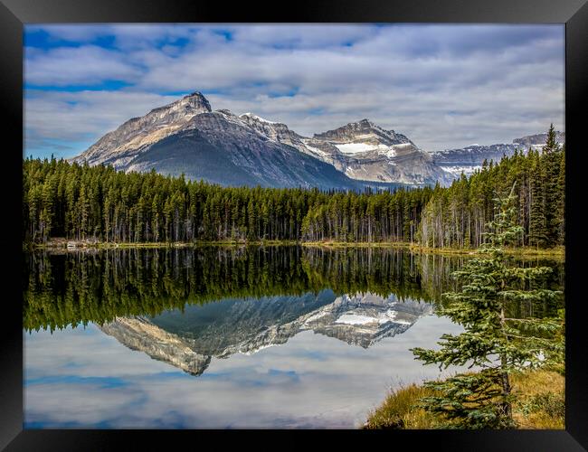 Mountain reflections in lake Framed Print by Chantal Cooper