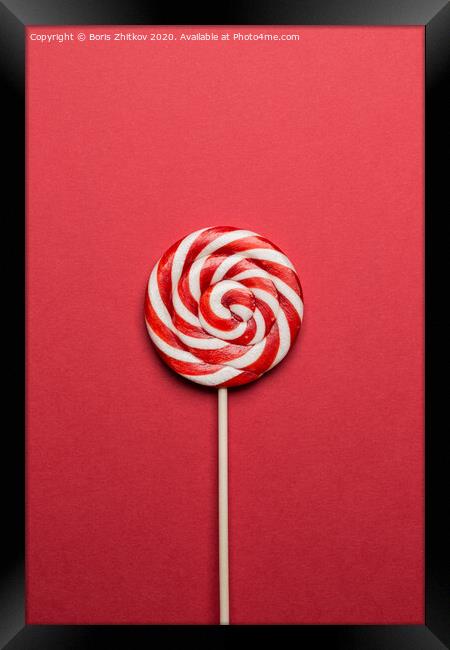 Lollypop on red background. Framed Print by Boris Zhitkov
