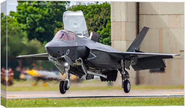 RAF F-35B Lightning vertical touch down. Canvas Print by MARTIN WOOD