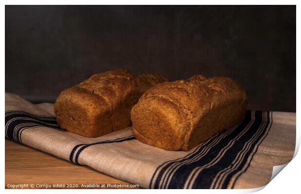 freshly baked bread on wood Print by Chris Willemsen