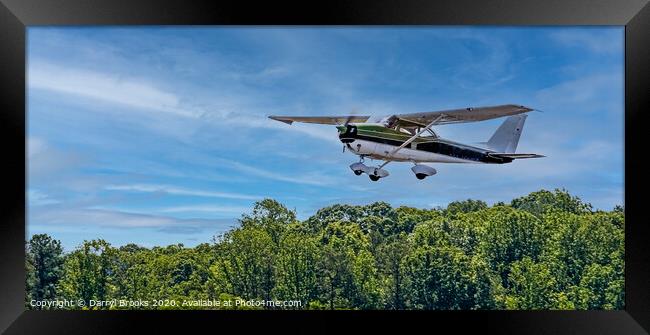 Green and White Plane in Flight Framed Print by Darryl Brooks