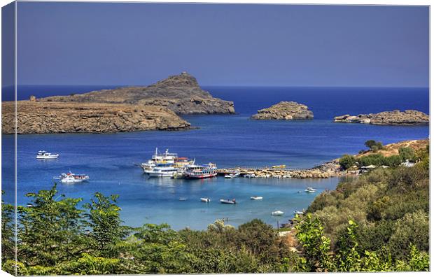 Boats in Lindos Bay Canvas Print by Tom Gomez