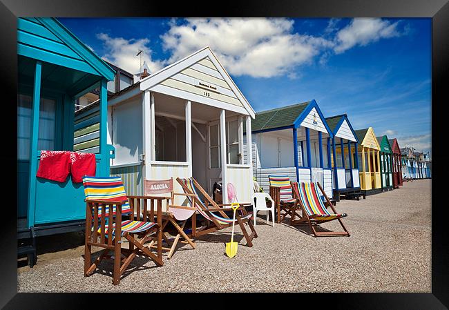 Deck chairs and beach huts Framed Print by Stephen Mole