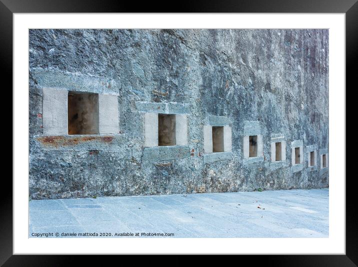 series of slits of an ancient castle Framed Mounted Print by daniele mattioda