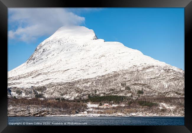 Snow covered hills on the Norwegian Coast in winter Framed Print by Dave Collins