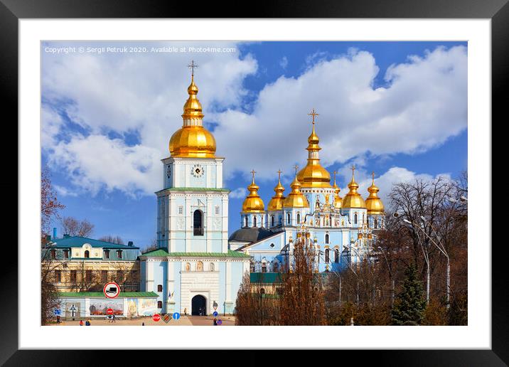 The famous Mikhailivsky Golden-Domed Cathedral and the bell tower in Kyiv in early spring against a blue cloudy sky. Framed Mounted Print by Sergii Petruk