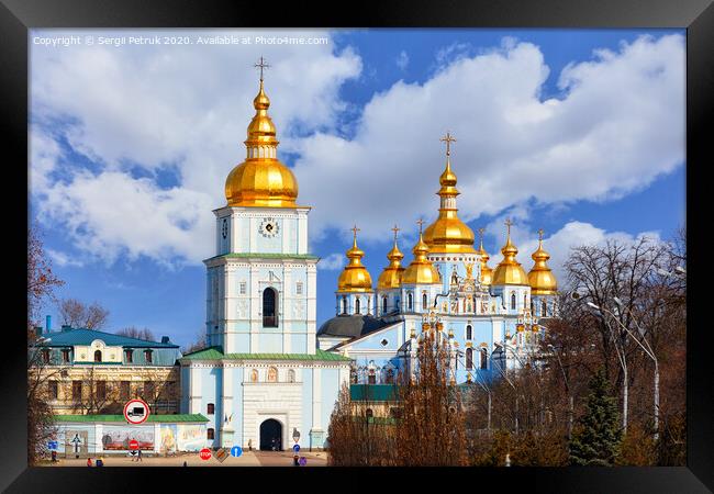 The famous Mikhailivsky Golden-Domed Cathedral and the bell tower in Kyiv in early spring against a blue cloudy sky. Framed Print by Sergii Petruk