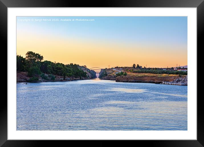 The Corinth Canal in the morning summer day illuminates the bright rising sun of Greece. Framed Mounted Print by Sergii Petruk