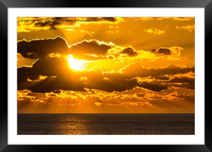 Atmospheric sunset over sea Framed Mounted Print by Geoff Smith