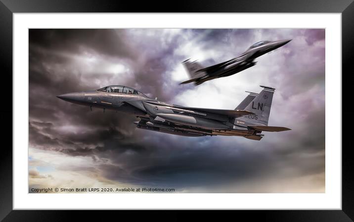 Two F-15E fighter jets passing in storm clouds Framed Mounted Print by Simon Bratt LRPS