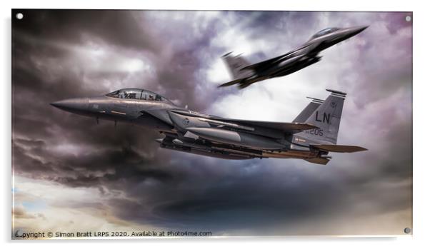 Two F-15E fighter jets passing in storm clouds Acrylic by Simon Bratt LRPS