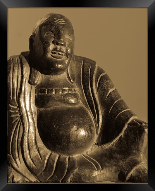  Carved wooden buddha figure in sepia tones. Framed Print by Peter Bolton