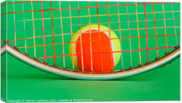 a racket and a tennis ball Canvas Print by daniele mattioda