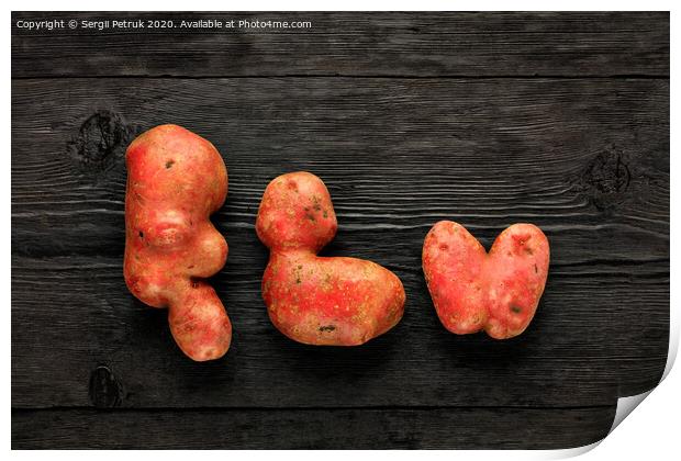 Ugly vegetables on a black wooden background. Vegetables or food waste concept. Top view, close-up. Print by Sergii Petruk