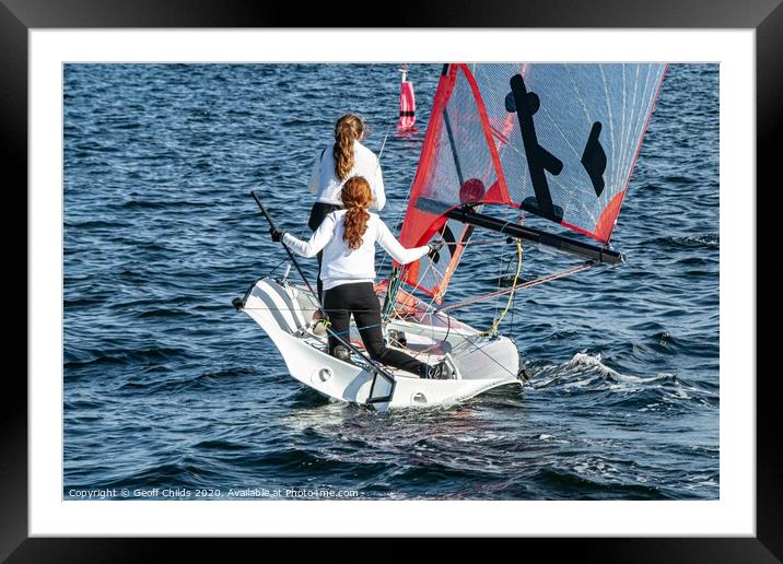 Two Girls Sailing small sailboat. Framed Mounted Print by Geoff Childs