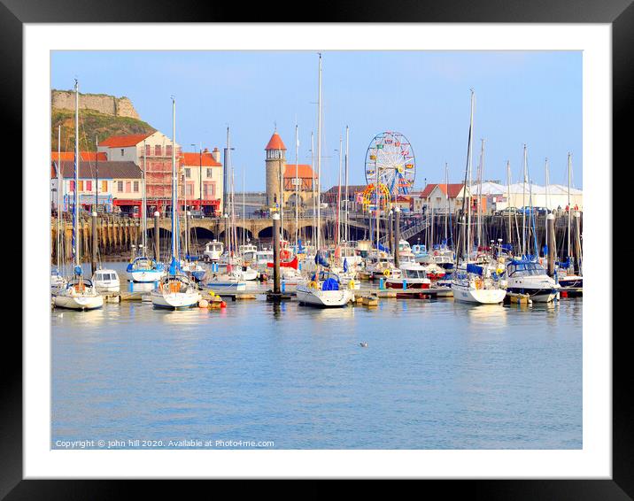 Harbour marina and funfair at Scarborough in Yorkshire.  Framed Mounted Print by john hill