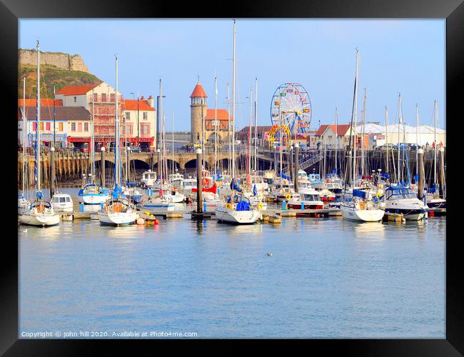 Harbour marina and funfair at Scarborough in Yorkshire.  Framed Print by john hill