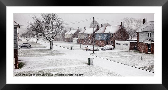 Snow blizzard street scene in rural Norfolk Framed Mounted Print by Simon Bratt LRPS