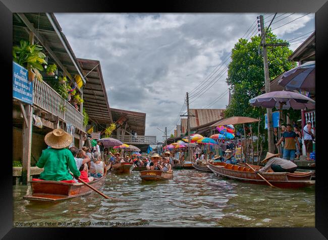 A floating market in Bangkok, Thailand. Framed Print by Peter Bolton