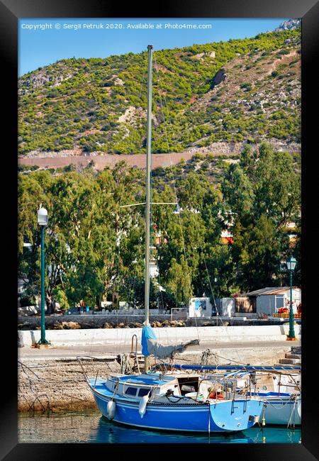 A small sailing yacht moored in the picturesque bay of the Ionian Sea, Loutraki, Greece. Framed Print by Sergii Petruk