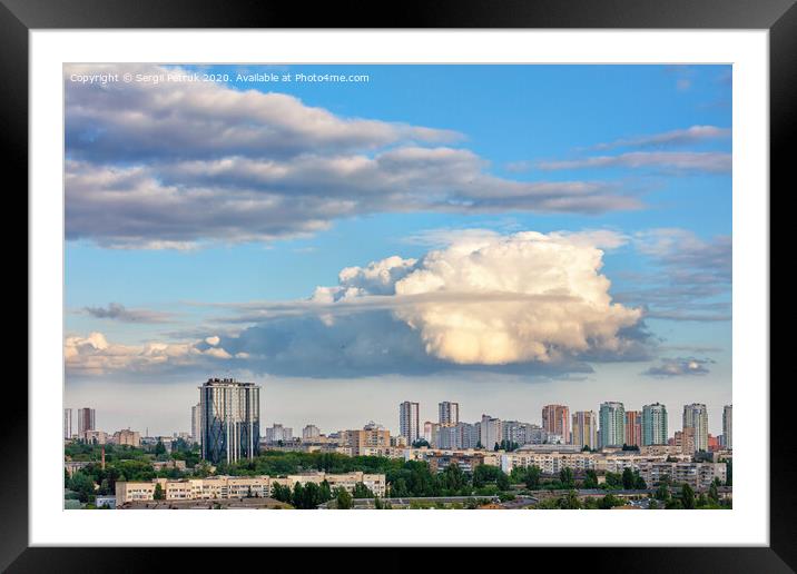 A large curly figured cloud hung over the city. Framed Mounted Print by Sergii Petruk