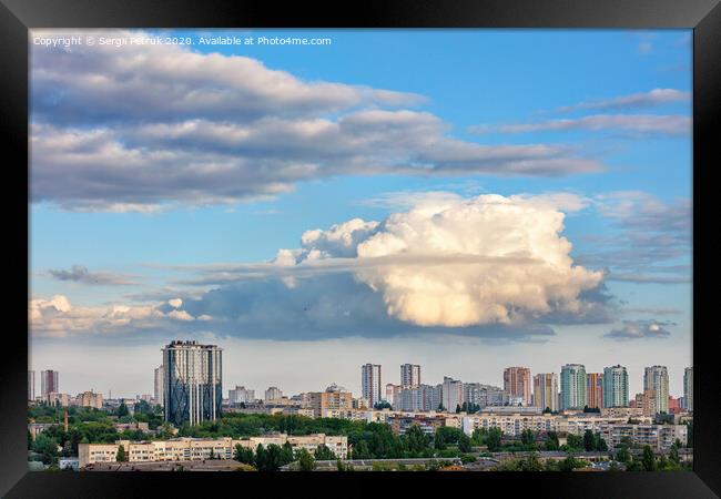 A large curly figured cloud hung over the city. Framed Print by Sergii Petruk