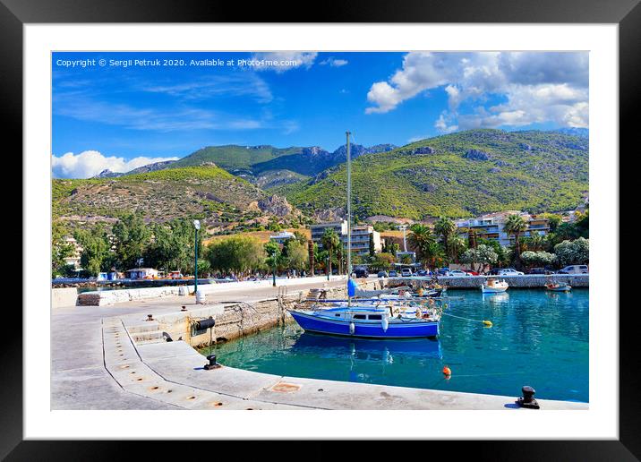 Scenic view of the bay and pier Loutraki, Greece, where small fishing schooners, yachts, boats and boats moored in the clear waters of the Ionian Sea. Framed Mounted Print by Sergii Petruk