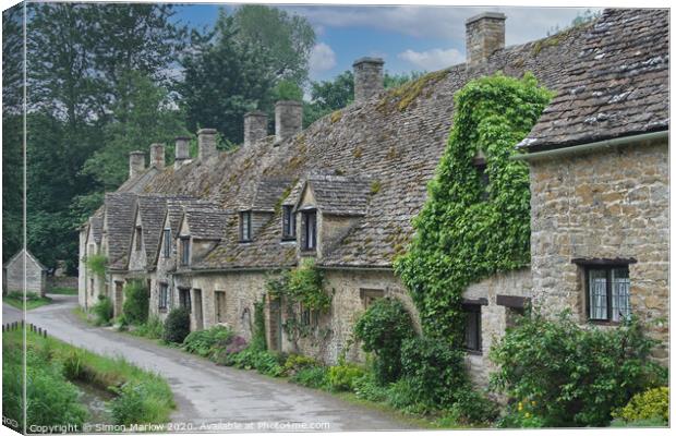 Enchanting Cotswold Cottages Canvas Print by Simon Marlow