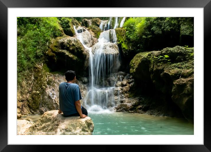 Young man enjoys the waterfall Mudal 3 Framed Mounted Print by Hanif Setiawan
