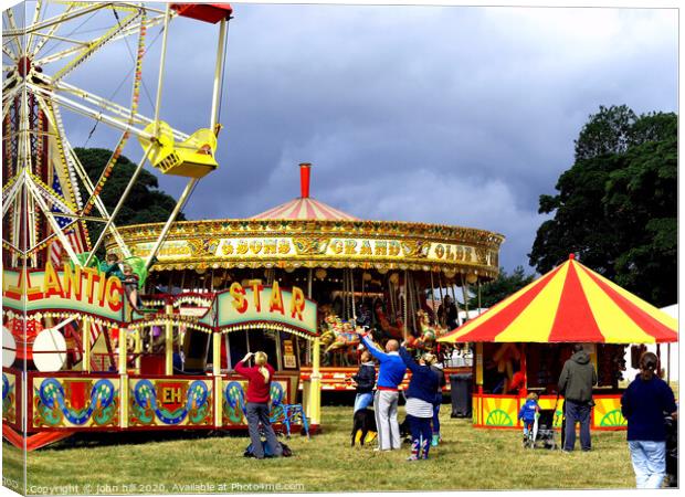 Summer funfair at country show. Canvas Print by john hill