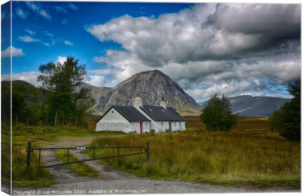Majestic Scottish Cottage in Glen Coe Canvas Print by Les McLuckie