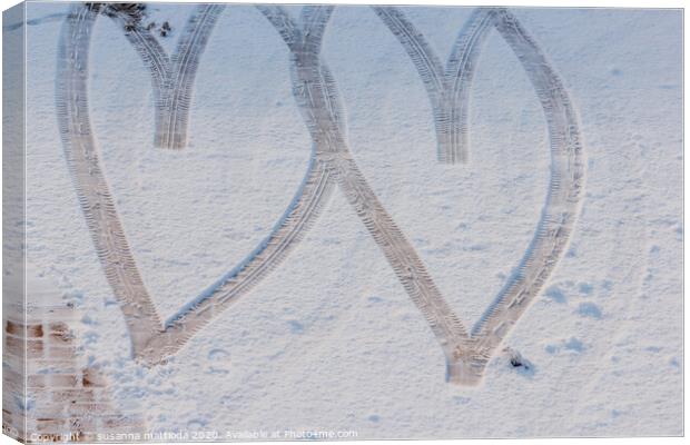 imprint of two hearts drawn in the snow Canvas Print by susanna mattioda