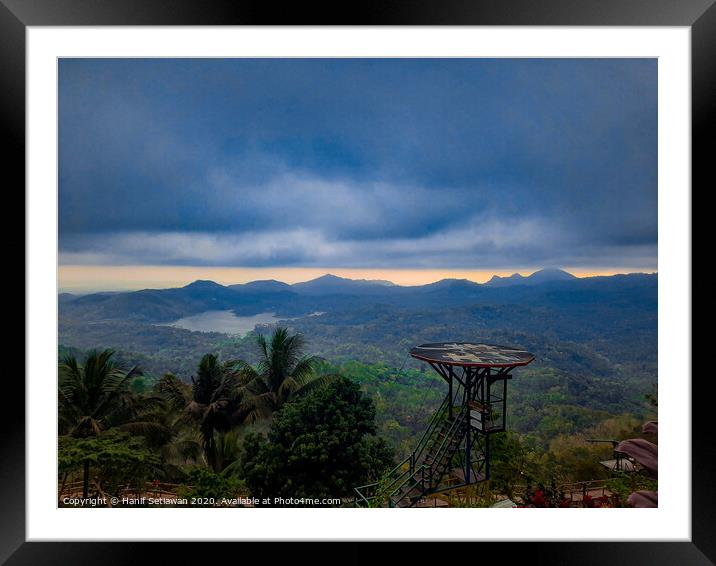 High seat on hill top with lake and mountains. Framed Mounted Print by Hanif Setiawan
