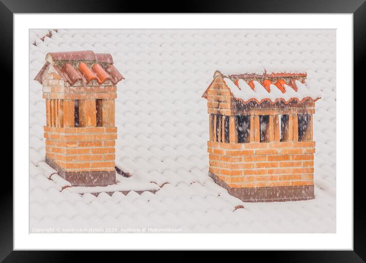 the chimneys of a house during a heavy snowfall Framed Mounted Print by susanna mattioda