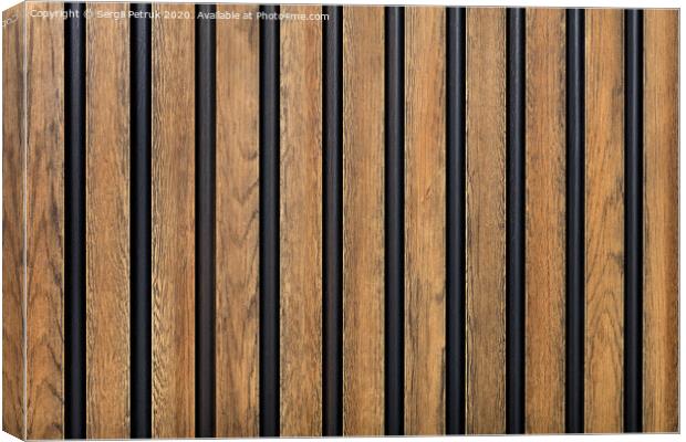 A fence made of vertical wooden decorative strips located parallel to each other. Canvas Print by Sergii Petruk