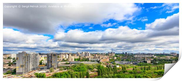 Panorama of cityscape with big low clouds and bright sunlight. Print by Sergii Petruk