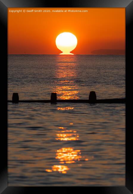 Sun touching the sea Framed Print by Geoff Smith
